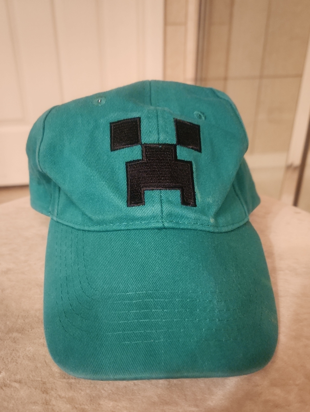 Teal Kids Baseball Hat with Black Pixel Face